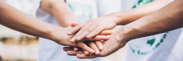close-up-people-volunteer-teamwork-putting-finger-star-shapehands-togetherstack-handsunity-teamwork-world-environment-day_640221-299 (1)